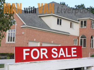 House with sell sign